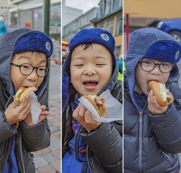 宋一国上传三胞胎大韩、民国与万岁吃热狗的照片。