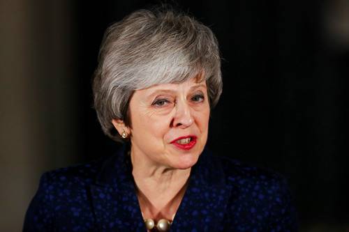 12月12日，在唐宁街10号外，英国首相特雷莎·梅在赢得党内信任投票后对媒体发表讲话。（路透社）