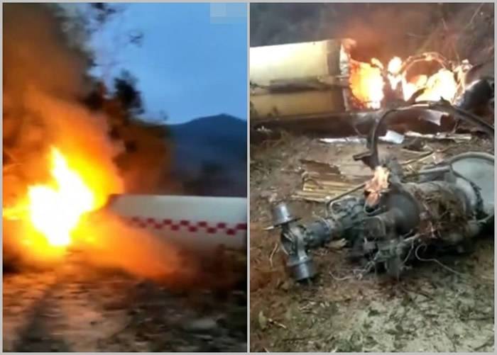 火箭发射残骸坠落后燃烧，机件散落一地。