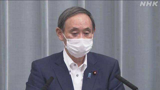 菅义伟出席25日的新闻发布会。NHK视频截图