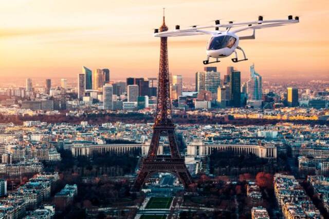 资料图片：德媒发布的漫游在巴黎上空的空中出租车想象图
