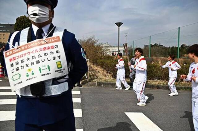 （图说：东京奥运圣火传递出发仪式在福岛举行。图/The New York Times）