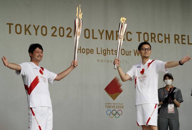 当地时间7月10日，日本八王子市，奥运会火炬传递第101日。图/IC photo