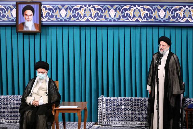 △图左为伊朗最高领袖哈梅内伊图右为伊朗新任总统莱希（图片来源：伊通社）