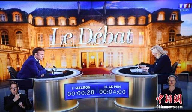 当地时间4月20日晚，马克龙与勒庞进行2022年法国总统选举电视辩论。中新社记者李洋摄