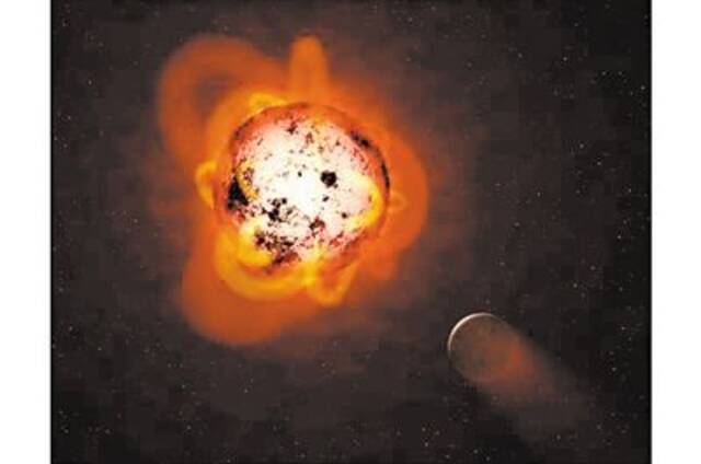 一颗行星绕红矮星运转艺术图。图片来源：物理学家组织网